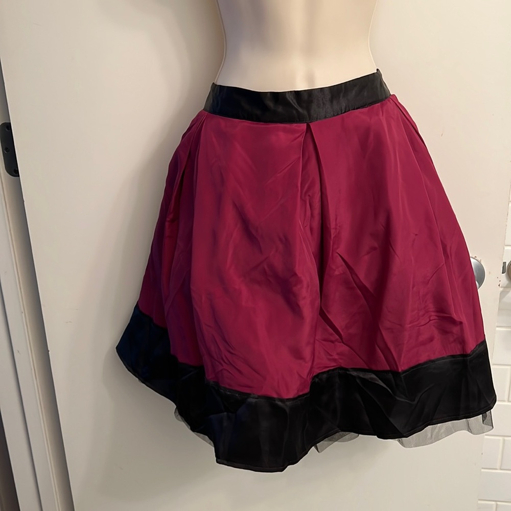 Deep violet with black trim satin like 100% skirt. Venus size 16